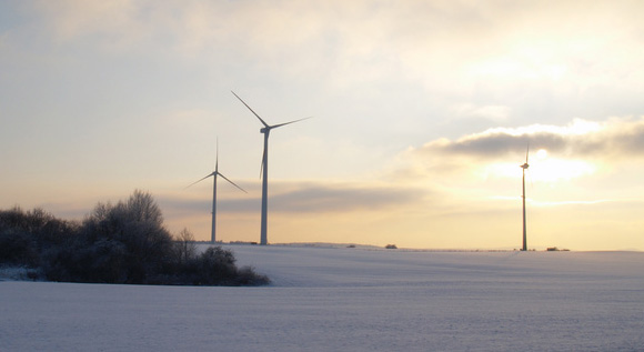 Wind turbines in a winter landscape.