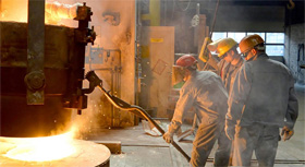 steel workers at blast furnace