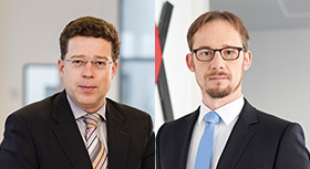 Paul-Georg Garmer, Senior Manager Public Affairs beim Übertragungsnetzbetreiber TenneT, und Dr. Maximilian Rinck, Experte für Strommarkt-Design bei der European Energy Exchange (EEX).