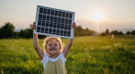 little girl with model of solar panel
